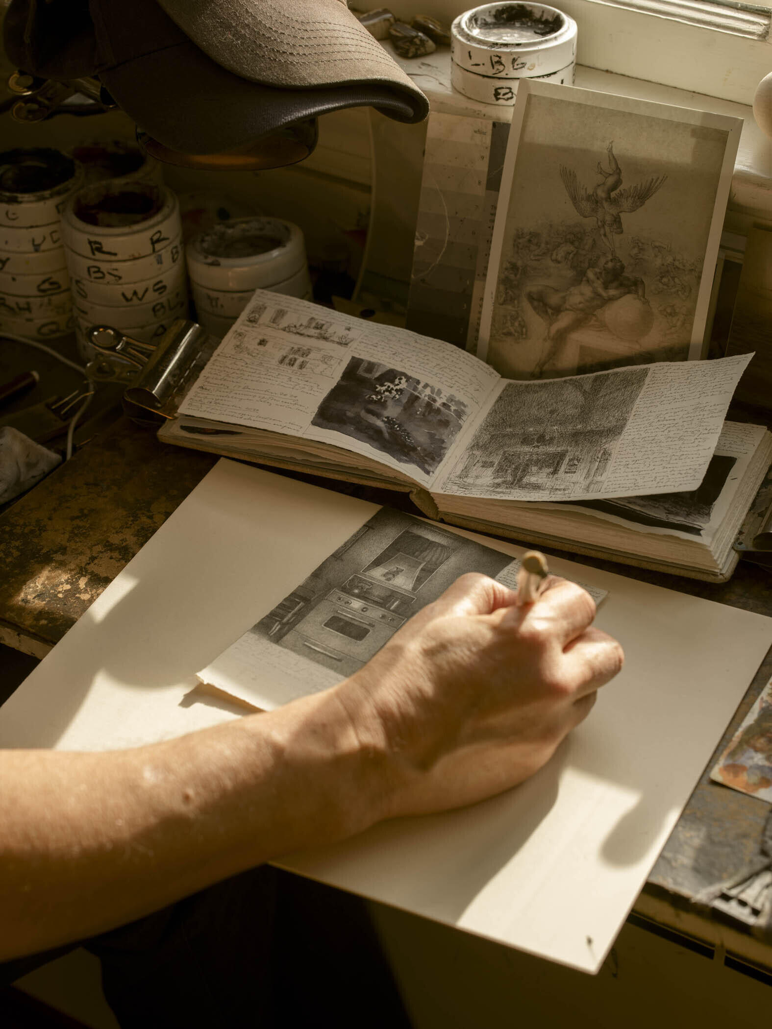 Photograph of the Artist Working on a Drawing, 2020 image