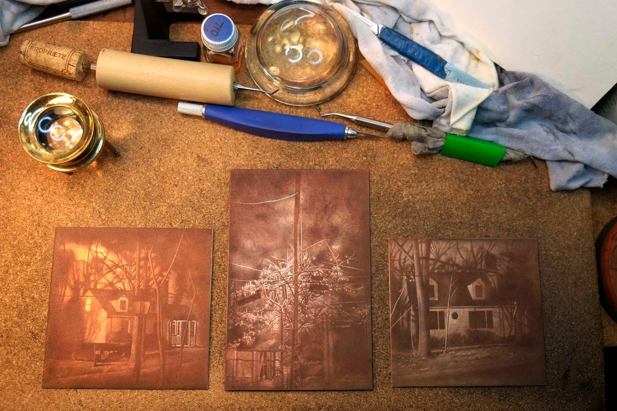 Photograph of three copper mezzotint plates, works in progress. image